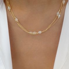 Attached layers Includes everything pictured Material: gold plated brass Length: 16" + 3" extension IMPORTED White Necklace With Adjustable Chain For Layering, White Double Strand Necklaces For Layering, Adjustable White Layered Clavicle Chain Necklace, White Adjustable Clavicle Chain Layered Necklace, White Choker Layered Necklace With Adjustable Chain, White Double Strand Layered Necklace With Delicate Chain, White Layered Choker Necklace With Adjustable Chain, White Dainty Layered Necklace, White Adjustable Choker Layered Necklace