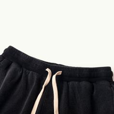 Baggy Cotton Black Cargo Shorts Beach - Raw Edge Helms - The baggy black cargo shorts are instantly eye-catching in the urban setting. Carefully crafted from 320GSM high-quality combed cotton with a breathable French Terry interior, these comfy shorts are tailored to a laid-back fit with design details that make them stand out from other cargo shorts. The side accordion pockets provide functionality and a structured look, while the distressed hem adds a rugged and edgy touch that contrasts perfe Cotton Bermuda Cargo Shorts For Streetwear, Bermuda Cotton Cargo Shorts For Streetwear, Washed Black Cotton Sweatpants For Streetwear, Baggy Streetwear Shorts With Side Pockets, Cotton Cargo Shorts With Drawstring, Urban Cotton Shorts With Cargo Pockets, Washed Black Sweatpants With Pockets For Streetwear, Summer Streetwear Sweatpants With Drawstring, Urban Cotton Cargo Shorts