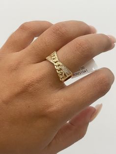 14K Fancy Cuban Link Cross Ring  -Solid 14K Gold -Available in a 7 US size  -Beautiful ring with CZ detail  -Yellow gold band  -Perfect for daily wear!  -Can be styled alone or with other rings  -(Message us if you have any questions-*ITEMS SOLD BY PIECE THEREFORE WEIGHT IS UNDETERMINED* Elegant Gold Chain Ring With Cubic Zirconia, Luxury Yellow Gold Chain Ring For Anniversary, Elegant Gold Cubic Zirconia Chain Ring, Gold-plated Wide Band Ring For Anniversary, Gold-plated Promise Rings, Diamond Rings For Anniversary, Tarnish Resistant, Anniversary Diamond Rings Tarnish Resistant, Yellow Gold Chain Ring With Diamond Accents, Elegant Gold Chain Ring For Anniversary