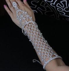 You are looking at a gorgeous Austrian rhinestone long slave glove/ bracelet with ring. This piece is perfect for wedding, party or any special occasions. Rhinestone design: 12"L X 2-3/8"W. Bracelet and ring band are both adjustable to fit most sizes. Prom Jewerly, Crystal Outfits, Diamond Gloves, Crystal Gloves, Rhinestone Gloves, Prom Gloves, Silver Gloves, Bracelet With Ring, Gloves Aesthetic