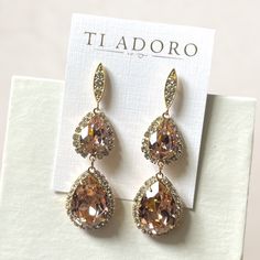 Ti Adoro Brand Addison Earrings Graceful, Classic, And Most Important Of All, Beautiful. The Addison Earrings From Ti Adoro Are Sure To Complement Any Gown You Wear And Make You The Talk Of The Ball. Made With Rose-Colored Stones With Crystals Surrounding Them, The Addison Earrings Are Nothing Short Of Elegant. Dimensions: 2 1/4” Color: Gold Stone: Rose Pink Stone Is Much Pinker In Person And Softer But With Light Reflection Appears More Gold Perfect For Wedding, Black Tie, Elegant Events New Wi Elegant Pink Chandelier Earrings For Formal Occasions, Elegant Pink Chandelier Earrings For Formal Events, Pink Dangle Crystal Earrings For Wedding, Glamorous Pink Bridal Earrings For Wedding, Glamorous Pink Bridal Earrings, Formal Pink Chandelier Earrings, Champagne Dangle Earrings For Wedding, Elegant Pink Dangle Bridal Earrings, Blush Drop Earrings For Wedding