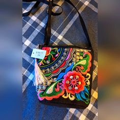 Colorful Embroidered Handbag Perfect For Any Outfit! 7 By 7 Size Embroidered Multicolor Bags For Everyday Use, Multicolor Floral Embroidered Tote Shoulder Bag, Multicolor Floral Embroidery Tote Shoulder Bag, Embroidered Rectangular Shoulder Bag For Spring, Embroidered Multicolor Rectangular Shoulder Bag, Multicolor Embroidered Everyday Bags, Spring Embroidered Rectangular Shoulder Bag, Spring Multicolor Floral Embroidered Shoulder Bag, Spring Multicolor Floral Embroidery Shoulder Bag