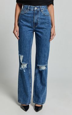 Make a statement in the Miho Jeans - a game-changer in eco-friendly fashion that doesn't sacrifice style for sustainability. These high-waisted, straight-leg denim jeans come in a deep blue wash that screams sophistication with a hint of rebellion, thanks to their strategically placed distressed details. Crafted from recycled cotton, they're as kind to the planet as they are on your curves, blending comfort with the chic street style seamlessly. Product Details: Straight Ripped Jeans Denim Fabri Straight Ripped Jeans, Eco Friendly Fashion, Street Style Chic, Straight Leg Denim, Game Changer, The Chic, High Jeans, Recycled Cotton, Ripped Jeans