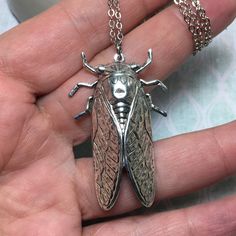 "Large cicada bug made of solid brass with silver plating and a locket hidden on the reverse side! Beautiful detail on this 2\" bug that is made with vintage molds that are nearly 100 years old. A truly unique necklace. Perfect gift for the bug lover! The locket is silver plated and in a tear drop shape. It can hold a special sentiment or tiny image. Check out this same locket in brass: https://www.etsy.com/listing/554860158/hidden-locket-necklace-cicada-large?ref=shop_home_active_6&pro=1&am Secret Compartment Necklace, Insect Jewelry Design, Unique Locket Necklace, Cicada Necklace, Bug Necklace, Beetle Necklace, Vintage Molds, Bug Gifts, Unique Locket