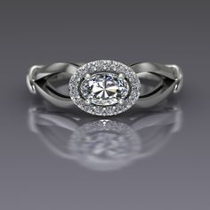 "An oval cut diamond is sideways set and surrounded by a halo of diamonds in this 14k white gold ring. Diamond is the April birthstone and has been given as an engagement ring for centuries. This petite east-west set ring measures about 7mm at the widest point. Oval Diamond Dimensions6x4mm (approx.) Carat Weight .37(approx.) EnhancementNatural ColorF-G ClaritySI1 CutVery Good PolishVery Good Diamonds Number16 EnhancementNatural Carat Total Weight0.12 ColorG-H ClaritySI2-I1 CutVery Good PolishVer Oval Halo Ring In Diamond White, Oval Diamond White Halo Ring, Oval Halo Ring With Diamond Accents In Platinum, Oval Halo Ring In Platinum With Diamond Accents, Oval Platinum Halo Ring With Diamond Accents, Oval Brilliant Cut Diamond White Halo Ring, Oval Diamond White Halo Ring With Rose Cut Diamonds, Oval Diamond White Ring With Halo, White Oval Platinum Halo Ring