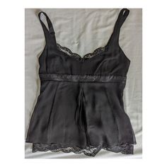 Evening Lace Top Camisole, Evening Cami Tank Top With Lace Trim, Elegant Black Camisole Blouse, Chic Black Lace Camisole Top, Evening Lace Trim Camisole Tank Top, Evening Lace Cami Tank Top, Lace Sleeveless Camisole For Evening, Lace Tank Top With Lace Trim For Evening, Fitted Lace Top Camisole For Evening