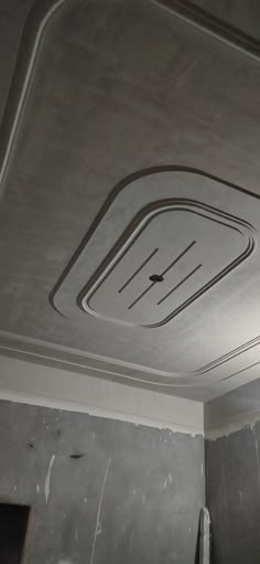 an unfinished room with some paint on the ceiling