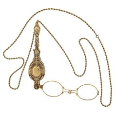 This vintage collectible lorgnette necklace is crafted in solid 14k yellow gold. It is very well detailed and features floral patterns throughout with an olympic style torch on both sides of the design. The lorgnette slides on a long, 35 inches rope link chain. The original finish and patina are intact and the piece remains in excellent overall physical and mechanical condition and is a great add to your collection. Enjoy :) Material: Solid 14k Yellow Gold (maybe slightly under karat due to age of production) Weight: 56.16 Grams Chain Type: 2.8mm Rope Link Chain Length: 35 Inches Clasp: Spring Ring Lorgnette Overall Length: 114.3mm (4.5") Lorgnette Overall Width: 28.4mm (1.1") Thickness: 12.1mm Condition: Vintage collectible piece in excellent overall physical and mechanical condition. Ori Opera Glasses, Historical Dress, Books Ideas, Dress Tutorials, Rope Chain Necklace, Historical Dresses, Rope Chain, Floral Patterns, Spring Rings