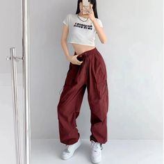 Features: Introducing the Women Punk Cargo Pants, perfect for the fashion-forward. Designed with a high waist and wide leg, these pants not only provide a flattering fit but also add a touch of streetwear edge to your wardrobe. Made with lightweight material, these pants are perfect for the summer season. Upgrade your style with these American Retro-inspired trousers. Y2k Wide-leg Pants With Pockets, Y2k Wide Leg Streetwear Pants, Baggy High-waisted Y2k Pants, Baggy Y2k Parachute Pants For Fall, Y2k Baggy High-waisted Pants, Y2k Style Baggy Parachute Pants For Fall, Y2k Baggy Parachute Pants For Fall, Hip Hop High Waist Bottoms For Fall, Y2k High Waist Streetwear Pants