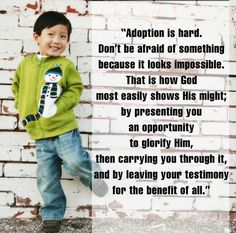 a little boy standing in front of a brick wall with a quote on it that reads, adoption is hard don't be afraid of something because it looks impossible