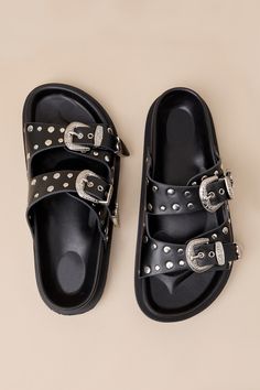 The Devaney Black Studded Western Buckle Slide Sandals were made for effortless styling, so you can spend more time out in the sun having fun! These faux leather sandals feature an almond-shaped footbed and wide adjustable straps embellished with silver studded details and Western-inspired buckles and tips with intricate embossing. A contoured insole completes the simple slide-on design. 0. 75" rubber sole. Smooth insole. Rubber sole has nonskid markings. Man made materials. Imported. Lulus | De Summer Sandals With Buckle Closure And Flat Heel, Summer Sandals With Buckle Closure Flat Heel, Summer Sandals With Adjustable Strap And Flat Heel, Leather Footbed Sandals With Flat Heel For Vacation, Trendy Leather Footbed Sandals For Beach, Vacation Leather Footbed Sandals With Flat Heel, Summer Black Sandals With Buckle Closure, Flat Heel Footbed Sandals With Buckle Closure For Beach, Summer Flat Sandals With Adjustable Strap