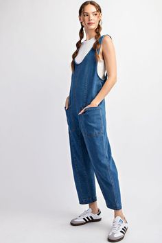 Mineral washed solid sleeveless jumpsuit featuring adjustable straps, a scoop neckline, two open front pockets and is a straight leg style. Model is 5'9" and wearing a small.75%COTTON 23%POLYESTER 2%SPANDEX Spring Medium Wash Overalls With Adjustable Straps, Trendy Overalls With Adjustable Straps, Casual Dark Wash Denim Jumpsuit With Side Pockets, Medium Wash Overalls With Adjustable Straps For Summer, Summer Medium Wash Overalls With Adjustable Straps, Relaxed Fit Overalls With Adjustable Straps For Spring, Summer Overalls With Adjustable Straps In Medium Wash, Casual Sleeveless Shortalls With Pockets, Spring Overalls With Adjustable Straps In Relaxed Fit