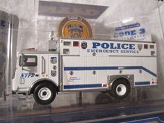 a toy fire truck is on display in a case