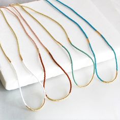 Seed Bead Necklaces for Women, perfect to layer or a fun piece of dainty jewelry to add a little splash of color!  D E T A I L S *Seed beads in your choice of color combination  *Hand strung in a modern pattern *14kt Gold-Filled beads & spring clasp Color combos:  white & beige  rust & blush  seafoam & beige  turquoise & turquoise  LENGTH *16 inches in length or 16 inches with a 2 inch extender  *Choose a 18 inch length or a 18 inch with a 2 inch extender for up to 20 inches. HOW TO PERSONALIZE Adjustable Gold Beaded Everyday Necklaces, Adjustable Gold Beaded Necklaces For Everyday, Minimalist Gold Beaded Necklaces For Jewelry Making, Minimalist Gold Beads Necklace For Jewelry Making, Minimalist Adjustable Charm Necklaces With Tiny Beads, Minimalist Adjustable Charm Necklace With Tiny Beads, Minimalist Adjustable Beaded Necklace With Gold Beads, Minimalist Gold Beaded Necklace With Colorful Beads, Neutral Seed Bead Necklace