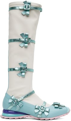 Knee-high stretch grained leather boots in blue and off-white. Pin-buckle straps with bow accents throughout. · Grosgrain trim at pointed toe · Jersey lining · Glittered fiberglass trim at heel · Treaded foam rubber outsole Supplier color: Frozen blue Angel Chen Boots, Shark High Heels, Cpnhgn Boots, Mrtallic Boots, Blue Mettalic Boots, Karl Lagerfeld Sock Boots, Boots Ice Cream, 70s Blue Boots, Ichi Boots