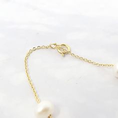 Our Freshwater Pearl Double Chain Wedding Bracelet, crafted with 18ct gold-plated copper and adorned with freshwater pearls, is the perfect elegant gift for brides, bridesmaids, or any special occasion.  Elevate your bridal ensemble with our Freshwater Pearl Double Chain Wedding Bracelet, an exquisite accessory perfect for bridesmaids or brides on their special day.   This jewellery arrives beautifully packaged and ready to gift. It would make a really thoughtful and meaningful birthday gift, Ch Refined Yellow Gold Pearl Necklace For Wedding, Delicate Baroque Pearl Bracelet With Pearl Chain, Delicate Baroque Pearl Chain Bracelet, Delicate Baroque Pearl Bracelet, Elegant Gold Bracelet With Baroque Pearl, Luxury Gold Pearl Necklace For Wedding, Classic Pearl Bracelet With Pearl Pendant For Weddings, Gold Oyster Bracelet Jewelry For Wedding, Pearl White Bracelets With Pearl Pendant For Weddings