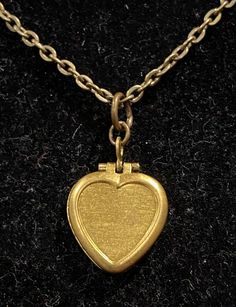 Necklace is antique bronze in color Measures 18 inches in length Locket measures .75 inches in length and depth Vintage Bronze Heart Necklace, Antique Bronze Heart-shaped Necklaces, Antique Bronze Heart Necklace, Antique Bronze Heart-shaped Necklace, Antique Bronze Heart Shaped Necklace, Vintage Gold Brass Heart Necklace, Vintage Gold Heart Necklace In Brass, Bronze Heart Necklaces For Valentine's Day, Bronze Heart-shaped Necklace For Valentine's Day