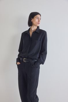 The lightweight poplin fabric of this classic blouse provides a crisp and breathable feel, making it ideal for year-round wear. The classic silhouette of this blouse is tailored for a comfortable fit that flatters every figure, while the subtle texture adds a touch of refinement. Light poplin fabric Long sleeves Breast box pockets Relaxed fit Elegant Cotton Blouse With Shirttail Hem, Modern Button-up Blouse For The Office, Effortless Spread Collar Work Shirt, Effortless Spread Collar Shirt For Work, Versatile Office Blouse With Relaxed Fit, Casual Business Blouse With Button Cuffs, Modern Relaxed Fit Blouse For Business Casual, Casual Blouse With Button Cuffs For Business, Modern Black Blouse For Business Casual