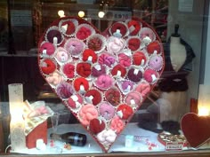 a heart shaped display in a store window