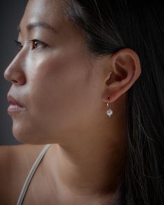 "These pearl hoop earrings feature a beautiful pearl on an open hoop. Our dainty hoop earrings are meant to be classic enough for everyday wear or to give as a bridesmaid gift. These natural pearl earrings will be a favorite of yours! SOLD AS A PAIR ** PLEASE NOTE: The model is wearing multiple earrings. This listing is for a pair of Mini Pearl Hoops Earrings only ** At LunaiJewelry, we take pride in the details and love we pour into everything we make. We know you'll find something lovely for y Everyday Pearl White Earrings, Everyday Teardrop Huggie Earrings With Pearl Drop, Elegant Teardrop Huggie Earrings With Lever Back, Everyday Round Pearl Earrings, Dangle Pearl Earrings With Lever Back, Everyday Huggie Drop Earrings With Pearl, Hypoallergenic Pearl Earrings For Everyday Wear, Classic Rose Gold Single Pearl Earring, Minimalist Pearl Drop Hoop Earrings For Anniversary