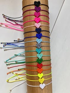 the bracelets are all different colors and have hearts on them