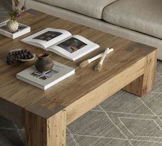 a coffee table with two books on it