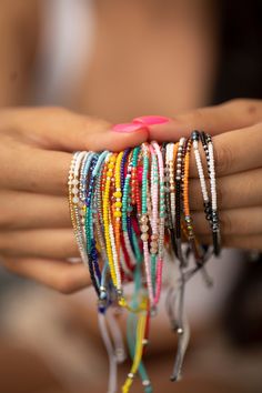 These bracelets are so cute and colorful, sure to give a pop of color to any look. They give a boho vibe and look great dressed up or down. Stack or wear alone. We have so many cute styles, and they makes the perfect gift! Details:       12 styles     Each stack comes with 3 rows of beads     Size is adjustable (7" - 9")     Materials:     Nylon with beads Trendy Wrap Bracelet With Colorful Beads For Gift, Trendy Tiny Beads Wrap Bracelet Gift, Dainty Adjustable Bracelets For Festivals, Trendy Beaded Bracelets With Tiny Beads For Parties, Trendy Turquoise Bracelets With Tiny Beads, Trendy Festival Hand-strung Friendship Bracelets, Trendy Hand-strung Friendship Bracelets For Festivals, Pink Adjustable Beaded Hippie Bracelet, Colorful Festival Bracelets