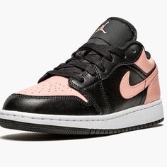 The Air Jordan 1 Low Crimson Tint Is Executed In A Two-Tone Black And Crimson Tint Color Block. The Air Jordan 1 Low Crimson Tint Upper Features A Mix Of Salmon Pink And Black Leather Inserts Covering The Forefoot, Eyelets, And Mid-Panel. The Usual Branding Is Present With The Logo Jumpman Embroidered On The Tongue, The Swoosh Running Across Both The Lateral And Medial Sides, And The Jordan Wings Embroidered At The Back. A White Rubber Midsole And Contrasting Black Outsole Round Out The Look. Pink Leather Basketball Shoes With Contrast Sole, Pink Leather Basketball Shoes With Laces, Pink Leather Basketball Shoes, Pink Leather Lace-up Basketball Shoes, Pink Low-top Basketball Shoes With Contrast Sole, Pink Leather Basketball Shoes With Branded Insole, Pink Leather Basketball Shoes With Round Toe, Pink Basketball Shoes With Contrast Sole, Sporty Pink Leather Jordan Shoes