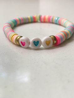 two bracelets that have hearts on them