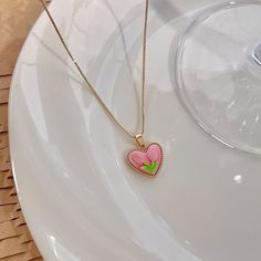 Trendy Pink tulip flower heart shaped pendant charm necklace, 14K real gold plated chain. Crafted from high-quality materials, this stunning necklace features a delicate heart-shaped pendant adorned with a beautiful pink tulip motif, symbolizing love, beauty, and new beginnings. Cute girly aesthetic, y2k layering necklace choker. Exquisite statement necklace to elevate your fashion style. 💎 Features: ♥ Handmade jewelry ♥ Finish Tone: Finest 14K gold plated | Pink ♥ Approximate Measurements: - L Tulip Necklace Aesthetic, Trendy Rose Gold Heart Necklace, Pink Flower Charm Necklace With Flower Pendant, Pink Flower Charm Necklaces For Gift, Pink Flower Charm Necklaces As Gift, Pink Flower Charm Necklace Gift, Pink Flower Pendant Necklace With Clavicle Chain, Pink Flower Pendant Necklace For Valentine's Day, Pink Flower Pendant Clavicle Necklace