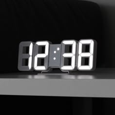 an alarm clock sitting on top of a table