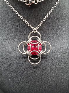 The birthstone tradition traces its roots back to ancient times, and has been found in several cultures worldwide. Garnet is recognized as the birthstone for January. While garnets can range in color from red, to yellow, to green, the most common color is a deep red, and this siam Swarovski captures its hues perfectly. Wearing the gemstone associated with your birth month is purported to bring good fortune, though it can simply make a thoughtful gift! Matching earrings available. This completed Ruby Jewelry With Stone Setting As Gift, Nickel Free Red Jewelry As Gift, Nickel Free Red Jewelry Gift, Nickel-free Red Jewelry For Gifts, Nickel-free Red Jewelry Gift, Red Stainless Steel Pendant Jewelry, Red Sterling Silver Jewelry With Round Stone, Ruby Necklace With Round Stone Setting, Red Ruby Gemstone Jewelry