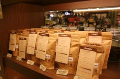 several bags of coffee sitting on top of a counter