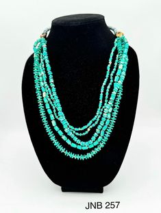 Turquoise color 5 row bead necklace . featuring gold matt balls of unique blend of style. size 24''-26'' Adjustable Gold Turquoise Necklace With Round Beads, Gold Turquoise Necklace With Round Beads, Multi-strand Turquoise Necklace With Large Beads, Adjustable Multi-strand Turquoise Beaded Necklace, Elegant Turquoise Beaded Necklaces With Oval Beads, Elegant Turquoise Beaded Necklace With Oval Beads, Turquoise Double Strand Polished Bead Jewelry, Turquoise Multi-strand Beaded Necklace With Large Beads, Turquoise Multi-strand Gemstone Beads Jewelry