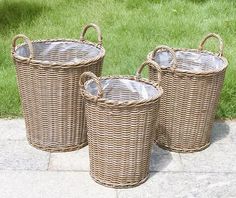 three wicker baskets sitting on the ground