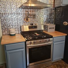 a stove top oven sitting inside of a kitchen