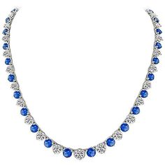 Made of 14k white gold, this necklace set with sparkling round cut diamonds that weigh approximately 22.40ct. The color of the diamonds range from G to I color, and the clarity VS1 to SI1. Accentuating the diamonds are high quality even colored blue Ceylon sapphires that weigh approximately 25.00ct. The necklace has a tapering width from 5mm to 8mm. It is stamped 14K and weighs 30.6 grams. Inventory #47634WRSSS Platinum Diamond Cut Round Bridal Necklace, Round Platinum Bridal Necklace With Diamond Cut, Platinum Bridal Necklace With Diamond Cut, Platinum Bridal Necklace With Diamond Accents, White Gold Crystal Bridal Necklace, Fine Jewelry Crystal Diamond Necklace, Dazzling Round Crystal Diamond Necklace, Bridal Diamond Necklace With Round Prong Setting, White Gold Round Rhinestone Necklace For Formal