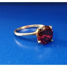 * Vintage Designer 14k Yellow Gold Round Red Quartz Solitaire January Ring * Ring Size: 6.0 * Top Of Ring Measures: 3/8" X 3/8" * Height: 3/8" * Band Measures: 1/16" * Red Quartz Total Carat Weight: Approximately 1.80 Tcw * Weight: 2.3 Tgw * Marked: 14k*Makers Mark * Condition: Great * G1059 Classic Red Ruby Jewelry, Classic Gold Ruby Ring Brilliant Cut, Classic Gold Ruby Ring With Brilliant Cut, Red Round Rings For Formal Occasions, Classic Red Birthstone Jewelry, Red Solitaire Rings As Gift, Yellow Gold Garnet Solitaire Jewelry, Classic Red Round Band Rings, Red Solitaire Ring With Round Band