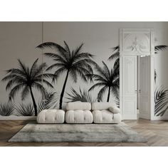 a living room with palm trees painted on the wall and rug in front of it