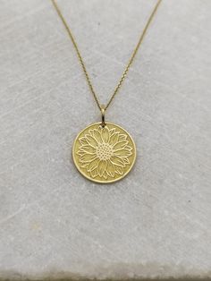 "14K Real Solid Gold Necklace, Hallmarked on the back of your pendant for certification! ▪️ A beautiful and clean engraved Sun Flower pendant made out of 14K Solid Real Gold. Available only in yellow gold! Pendant Thickness: 0.50mm Jump Ring inner diameter: 4mm Dimensions - Small - 13x13mm / 0.51 x 0.51 inches Medium - 14x14mm / 0.55 x 0.55 inches Big - 15x15mm / 0.59 x 0.59 inches Necklace Length - You can choose your chain length from 35CM to 50CM. The pendant is available alone without a chai Yellow Gold Plated Flower Jewelry, Gold Plated Yellow Gold Flower Jewelry, Yellow Gold Birth Flower Pendant Jewelry, 14k Gold Birth Flower Pendant Jewelry, Wedding Jewelry With Sunflower Design, Gold Engraved Flower-shaped Jewelry, Gold Engraved Flower-shaped Necklace, Yellow Gold Pendant Jewelry With Flower Charm, Yellow Gold Round Pendant With Flower Charm