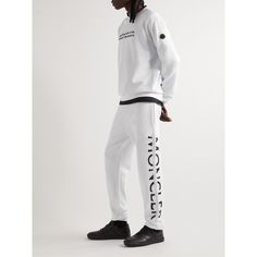 Moncler's sweatpants are designed from soft cotton-jersey with their signature logo embroidered at the side. They have a relaxed silhouette with tapered cuffs and an elasticated waistband. Style it with a hoodie or oversized knit on casual days. Luxury Cotton Sweatpants For Streetwear, Cotton Sweatpants With Logo Detail For Streetwear, Sports Sweatpants With Logo Detail, Moisture-wicking Cotton Sweatpants For Streetwear, Luxury Men's Sweatpants With Logo Waistband, Oversize Knit, Mens Sweatpants, Signature Logo, Logo Embroidered