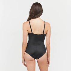 This versatile bodysuit is the ultimate solution for low-back dresses! The flawless-finish fabric is lightweight, cling-free, and offers 360 degrees of comfortable, single-layer shaping for a sleek, all-over feel. And, best of all? The innovative design features lightly padded, fit-flexible wireless cups and adjustable, convertible straps for a variety of styling options Second-skin Bodysuit With Built-in Bra And Low Back, Fitted One-piece Bodysuit With Lined Body, Stretch Bodysuit With Built-in Bra, Second-skin Bodysuit With Spaghetti Straps And Built-in Bra, Solid Nylon Bodysuit With Built-in Bra, Sleek Fitted Swimwear With Built-in Bra, Shapewear Leotard With Built-in Bra, Second-skin Fit Low Back Leotard With Lined Body, Second-skin Low Back Leotard With Lined Body