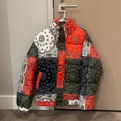 Brand New Condition Red Patchwork Outerwear For Streetwear, Casual Multicolor Winter Puffer Jacket, Multicolor Fall Puffer Jacket For Outdoors, Casual Fall Patchwork Puffer Jacket, Casual Multicolor Puffer Jacket, Casual Patchwork Puffer Jacket For Fall, Casual Multicolor Puffer Jacket For Outdoor, Urban Multicolor Patchwork Outerwear, Casual Red Puffer Jacket For Streetwear