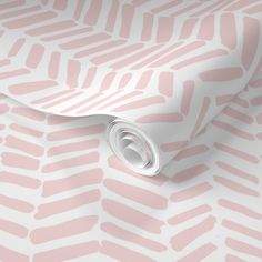 a pink and white wallpaper with an abstract pattern