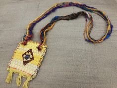 "This one of a kind bohemian necklace is made of a \"kourelou'' piece. \"Kourelou'' is the Greek name for the traditional colorful rug, made from recycled strips of cotton fabrics. The \"kourelou'' pendant is decorated with fine grosgrain fabric, which is hand embroidered with semi-precious jasper and sodalite chip beads and with high quality sari pure silk yarn in an impressive range of colors The lovely materials with different textures, the decorative hand stiches details and the vibrant summ Traditional Rectangular Necklace For Festivals, Traditional Multicolor Rectangular Necklace, Bohemian Multicolor Rectangular Jewelry, Bohemian Festival Necklaces, Fair Trade, Bohemian Long Beaded Necklaces For Festivals, Bohemian Beaded Long Necklace For Festivals, Bohemian Long Beaded Necklace For Festivals, Bohemian Fair Trade Festival Necklaces, Bohemian Rectangular Beaded Necklaces For Festivals