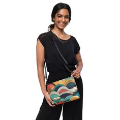 Retro Abstract Crossbody Bag: Stylish & Durable! Elevate your style with our Retro Abstract Crossbody Bag, featuring a vibrant colored abstract pattern that exudes retro charm. Crafted from premium faux leather and lined with 100% polyester, this bag is not only stylish but also built to last. The dark gray hardware adds a touch of sophistication, while the zip-top closure and multiple inside pockets ensure that your essentials stay secure and organized. What makes this crossbody bag truly unique is its versatility. With removable wrist and shoulder straps, you can effortlessly transition from a daytime accessory to a chic evening bag. The adjustable strap drop length of 14"-27" guarantees a comfortable fit for all body types. Measuring 11" x 8" x 1.5", this bag offers the ideal size for y Chic Evening Bags, Groovy Retro, Retro Abstract, Bold Style, Night Looks, Abstract Styles, Zip Top, Bold Fashion, Sling Bag