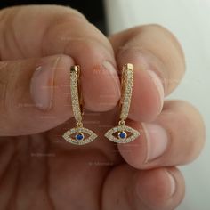 Natural Blue Sapphire SI Clarity G-H Color Diamond Evil Eye Charm Huggie Hoop Drop Earrings Solid 14K Yellow Gold Minimalist Good Luck Earrings For Women * SKU: SGE01027 * Made to Order * Gold Purity: 14K Solid Yellow Gold (stamped) * Custom Gold Color: Rose Gold, Yellow Gold, White Gold * Custom Gold Purity: 9K/14K/18K (Charges Apply) * Diamond 100% Genuine Diamond * Diamond Weight: 0.22 ct. * Diamond Color: G-H * Diamond Clarity: SI1- SI2 * Diamond Cut: Brilliant Cut (Excellent) * Blue Sapphir Blue Huggie Single Earring, Blue Huggie Hoop Earrings For Pierced Ears, Blue Minimalist Hoop Huggie Earrings, Minimalist Blue Huggie Hoop Earrings, Blue Minimalist Huggie Hoop Earrings, Blue Huggie Hoop Earrings For Everyday, Everyday Blue Huggie Hoop Earrings, Blue Huggie Hoop Earrings In Fine Jewelry, Blue Huggie Earrings For Everyday