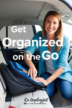 a woman sitting in the back seat of a car with luggage