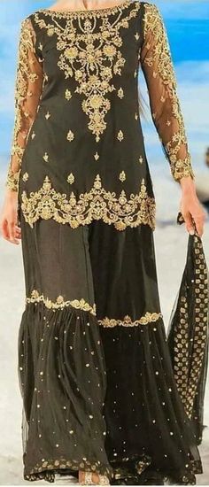 Product Description:  Have your dream look with this luxurious Black Gharara set. Intricate gold hand-worked with beautifully embellished duppatta. Color: Black Can be customized in any color Includes:  Gharra Set Duppata Gold Palazzo Set With Resham Embroidery, Floor-length, Gold Resham Embroidery Floor-length Palazzo Set, Gold Floor-length Lehenga With Dabka Detailing, Gold Floor-length Lehenga With Dabka, Gold Resham Embroidered Floor-length Palazzo Set, Gold Dabka Floor-length Lehenga, Elegant Sharara With Gold Embroidery, Elegant Gold Sharara With Intricate Embroidery, Elegant Sharara With Gold Embroidery And Traditional Drape