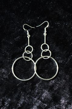 "Simple, modern and pretty lightweight for their size, these earrings will still make a statement and create a lot of movement around your face. You'll get to select your preferred ear wire type and a style variation. I offer sterling silver and non-precocious metal ear wires, which is reflected in the price. The last photo will help you figure out the type you want.  The style variation is very subtle. Pick the mirror polished \"smooth\" option if you are an elegant minimalist, or the \"texture Modern Stainless Steel Drop Earrings, Modern Silver Metal Hoop Earrings, Modern Metal Jewelry With Simple Design, Trendy Nickel-free Linear Drop Earrings, Modern Nickel Free Jewelry For Party, Modern Nickel-free Jewelry For Party, Modern Stainless Steel Dangle Jewelry, Silver Minimalist Drop Earrings, Modern Metal Drop Earrings